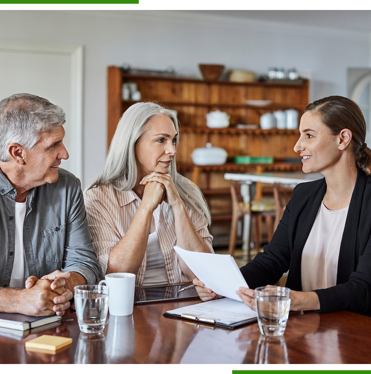 Older couple consulting with a financial advisor.