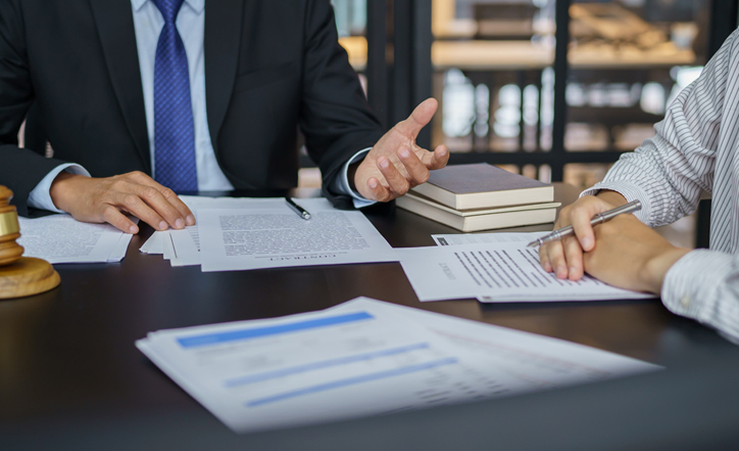 Office discussion with papers and books