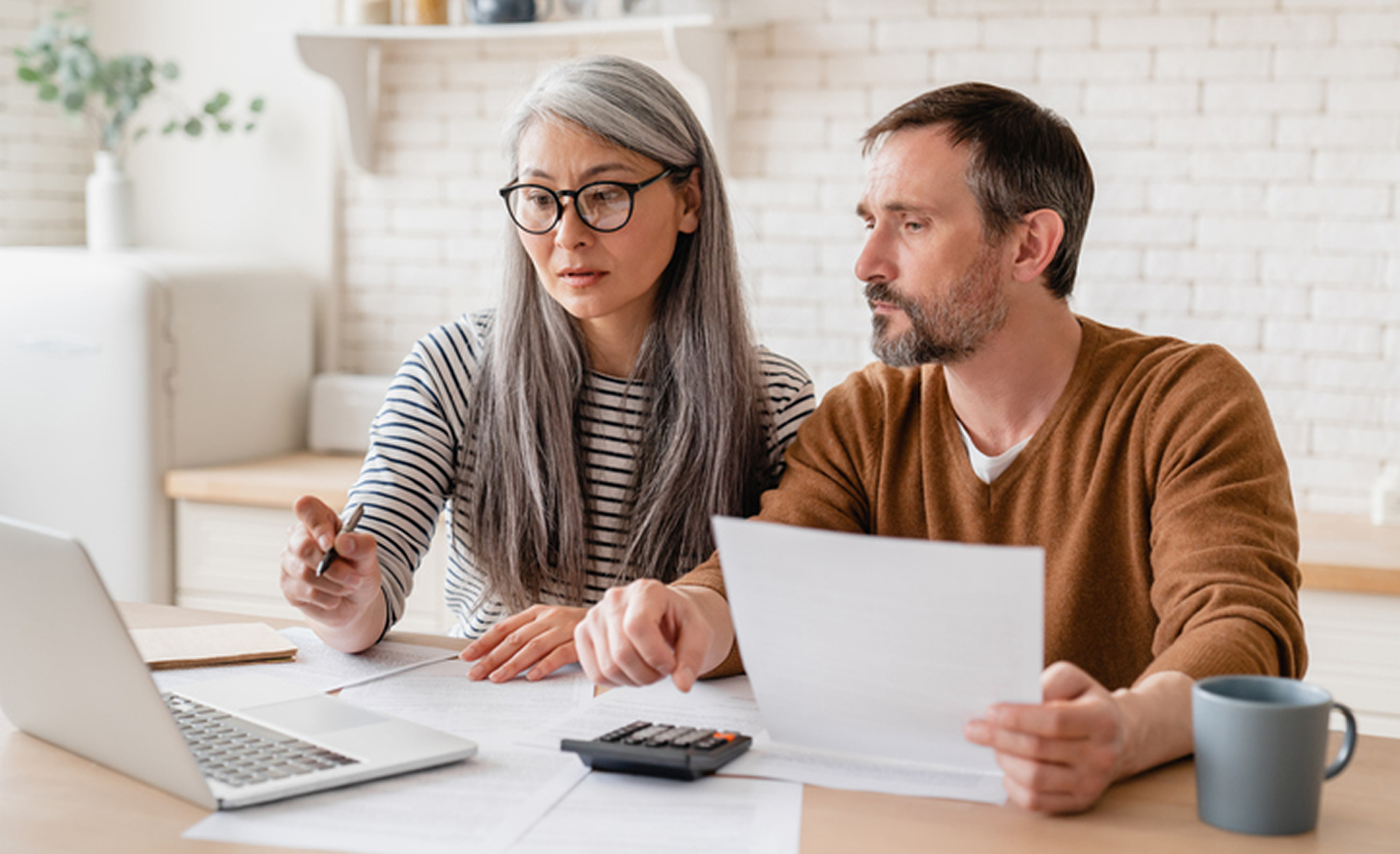 Pair working on financial planning